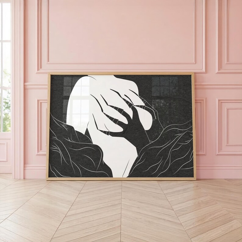 May include: Black and white abstract art print in a wooden frame. The artwork depicts a figure with hands covering the face, surrounded by stylized organic shapes. The contrast between light and dark creates a dramatic effect.