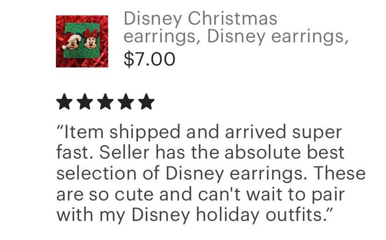 May include: A pair of red and green Christmas earrings featuring Mickey Mouse and Minnie Mouse. The earrings are on a red and green background.