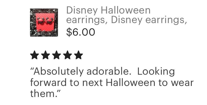 May include: A pair of Disney Halloween earrings, featuring a Mickey Mouse design. The earrings are displayed on a red card with a polka dot pattern, surrounded by silver confetti. The text reads "Disney Halloween earrings, Disney earrings."