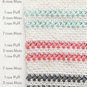 May include: A close-up of a white crocheted fabric with stripes of different colors. The stripes are made of puff stitches and moss stitch. The colors of the stripes are mint green, coral pink, and gray.