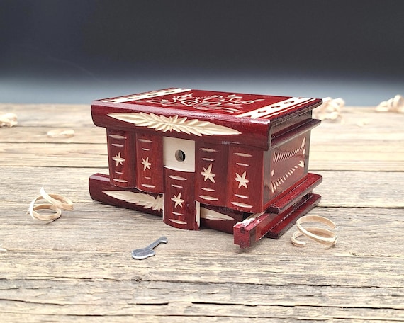 A brain-teaser puzzle box with serious handmade craftsmanship and 32 favorites — the kind of object that sits on a desk and baffles every visitor.