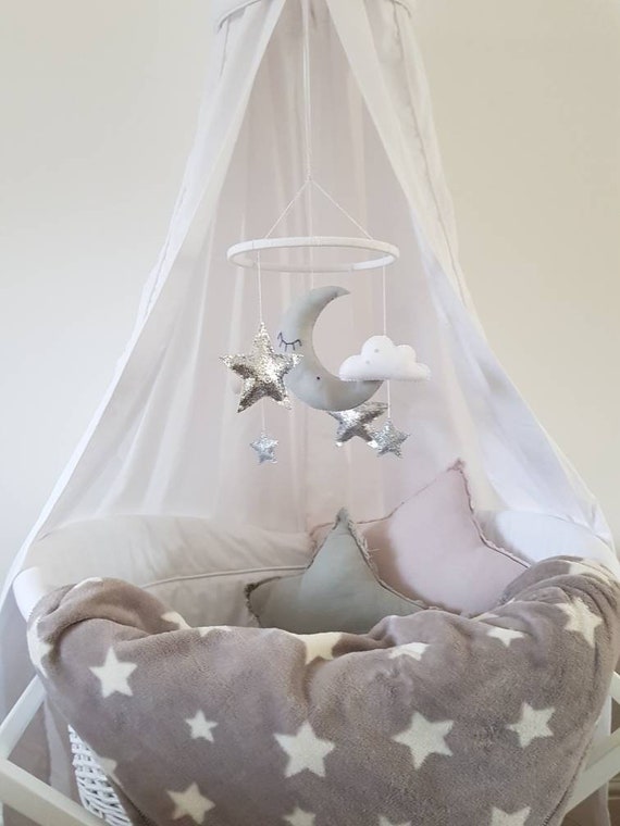 grey and white cot mobile