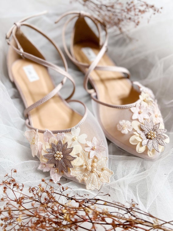 Premium Photo  Bride shues with flowers on the table. pink