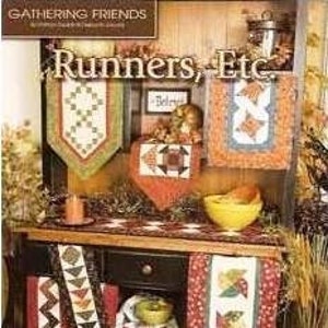 May include: A collection of table runners and placemats featuring various autumnal patterns, including leaves, pumpkins, and geometric designs. The runners are made in a variety of fabrics, including cotton and linen, and are available in a range of colors, including red, orange, yellow, and green.