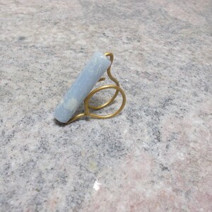 Handmade ring with bronze wire and ciel acrylic bead.