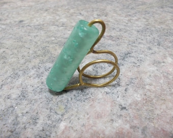 Handmade ring with bronze wire and turquoise acrylic bead.