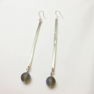 Handmade earrings from alpaca and glass stones.