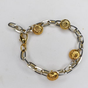 Handmade chain bracelet for women with gold and silver stainless steel materials.