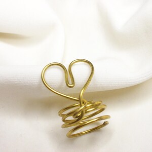 Modern handmade ring in gold, heart-shaped
