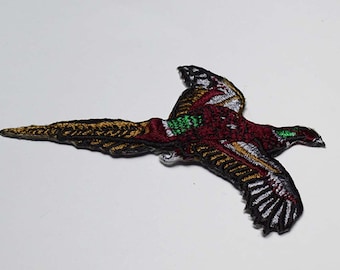 Iron on bird: 4" (L) x 2.75" (H)