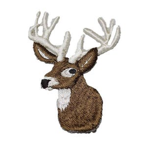 May include: Embroidered patch of a brown deer head with white antlers. The deer has a brown body and white markings on its face.
