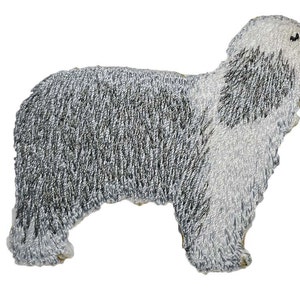 May include: A gray and white embroidered patch of an Old English Sheepdog.