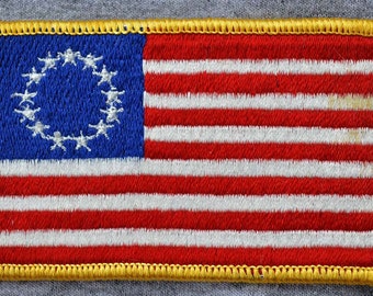 Left Arm Iron on American Flag: 3.50" (L)x 2.25" (H)