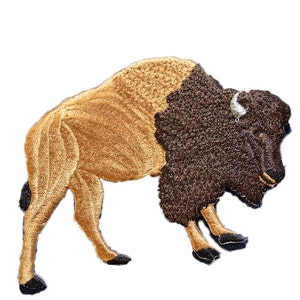 May include: Embroidered patch of a brown and black bison, standing with its head lowered. The bison has a white horn and is facing the left side of the image.