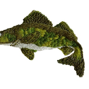 May include: Embroidered patch of a green and white fish with a detailed design. The fish is in a jumping position with its tail raised.