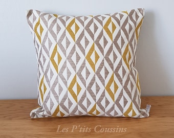 Cushion cover with geometric patterns in mustard yellow, beige and light brown, classic and chic decoration