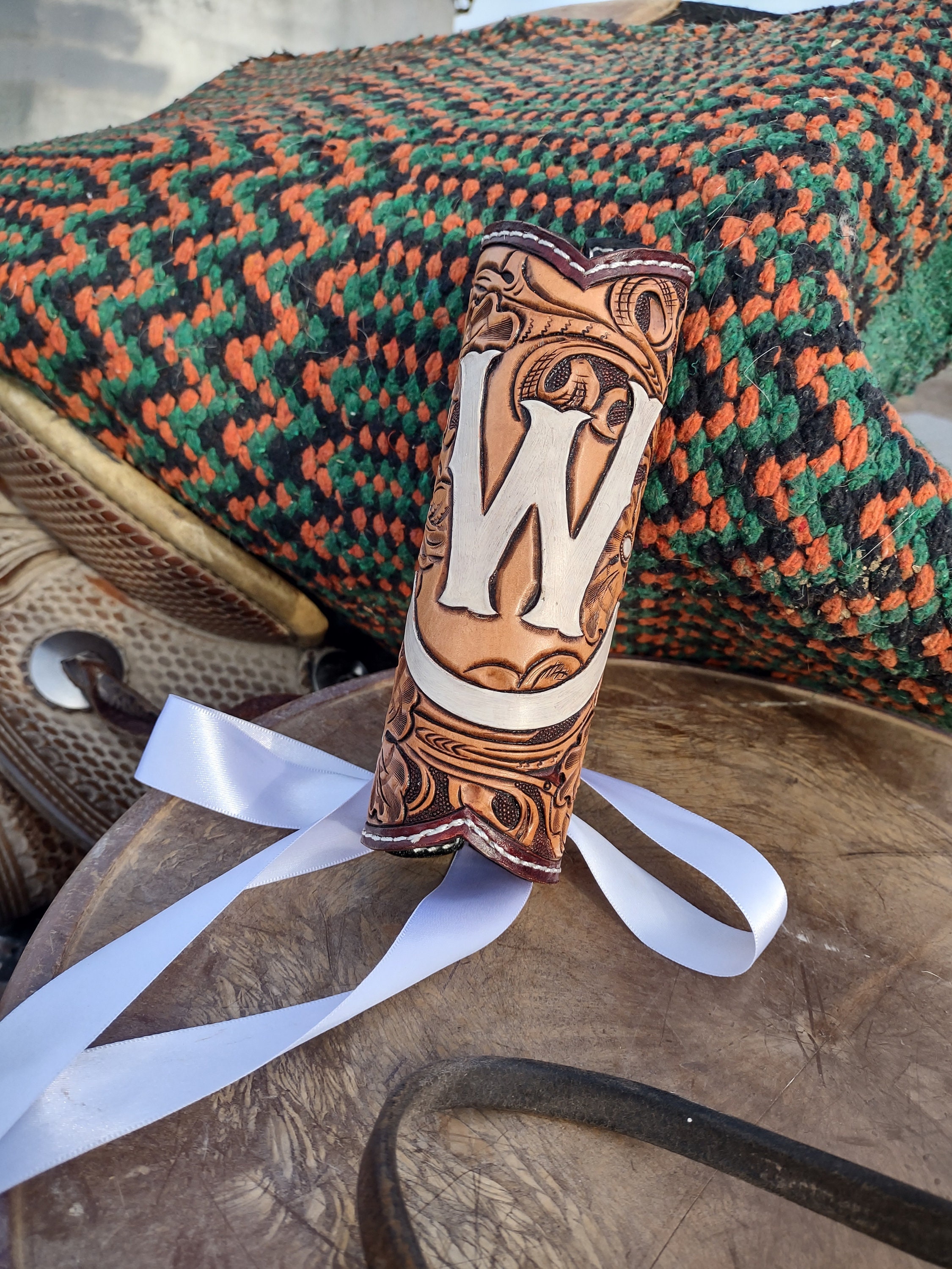 Tooled leather bouquet wrap and matching garter