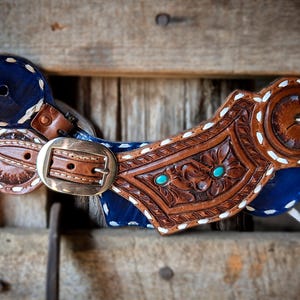Tooled leather buckstiched spur straps