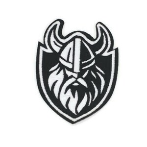 May include: Black and white embroidered patch of a Viking warrior's head with a horned helmet and beard, inside a shield shape.