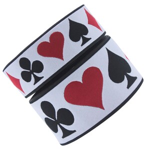 May include: White elastic with black and red playing card symbols. The symbols are hearts, spades, and clubs.
