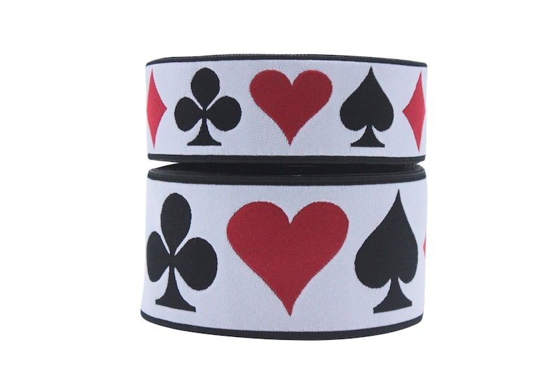 May include: Two rolls of white elastic with black trim. The elastic has a repeating pattern of red hearts, black spades, black clubs, and red diamonds.