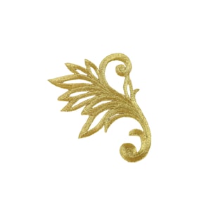 May include: Gold-coloured embroidered applique featuring a stylised floral design with a leaf and a scroll.