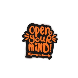 May include: Orange embroidered patch with the text "Open your mind!" on a black background. An arrow is below the text.