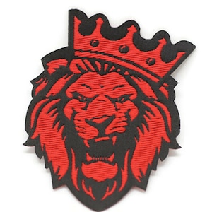 May include: Red embroidered lion head with a black crown on a white background.