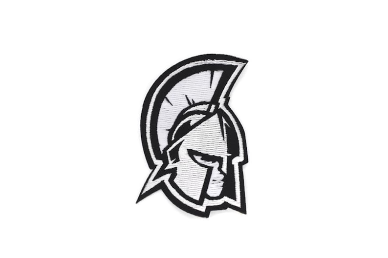 May include: Black and white embroidered patch of a Spartan helmet with a plume.