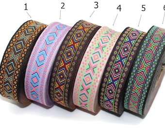 May include: Six rolls of colorful patterned trim with black backgrounds. The trim has a geometric design with orange, blue, green, pink, and red accents. The trim is numbered 1 through 6.