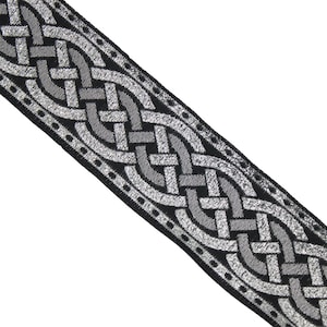 May include: Black and silver woven trim with a Celtic knot design.