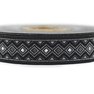 May include: Black and white patterned ribbon with a diamond design. The ribbon is rolled up and ready to be used for crafts, gift wrapping, or other decorative purposes.