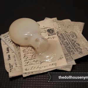 Miniature 1:12 spilled potion on magic scrolls for witch doll house or magic shop