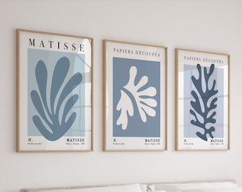 May include: Three framed prints with blue and white abstract art. The prints feature the text "PAPIERS DECOUPES" and "MATISSE".