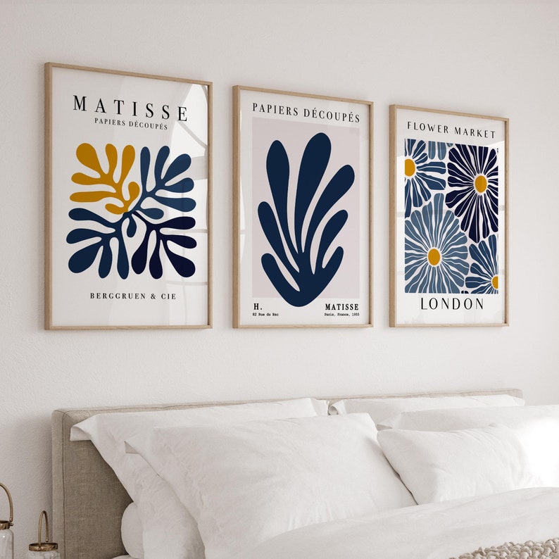 Set of 3 vintage Matisse-inspired wall art prints in navy blue and yellow, featuring botanical and abstract designs. Perfect for modern home décor."