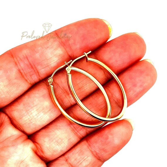 Oval-Shaped 14k Gold Hoops - image 2