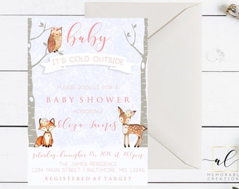 May include: A baby shower invitation with a winter woodland theme. The invitation features a pink and white background with a banner that reads "baby it's cold outside". There are illustrations of a fox, a deer, and an owl. The text on the invitation reads "Please join us for a baby shower honoring Eliza Jones, Saturday, December 18, 2018 at 1:00pm, The James Residence, 1234 Main Street, Baltimore, MD 12345, Registered at Target."