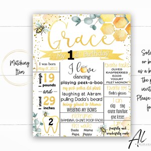 May include: A gold and white printable first birthday milestone sign with a bee theme. The sign features the name "Grace" and details about her first year, including her weight, height, favorite foods, and first words. The sign is decorated with bees, honeycombs, and watercolor flowers.