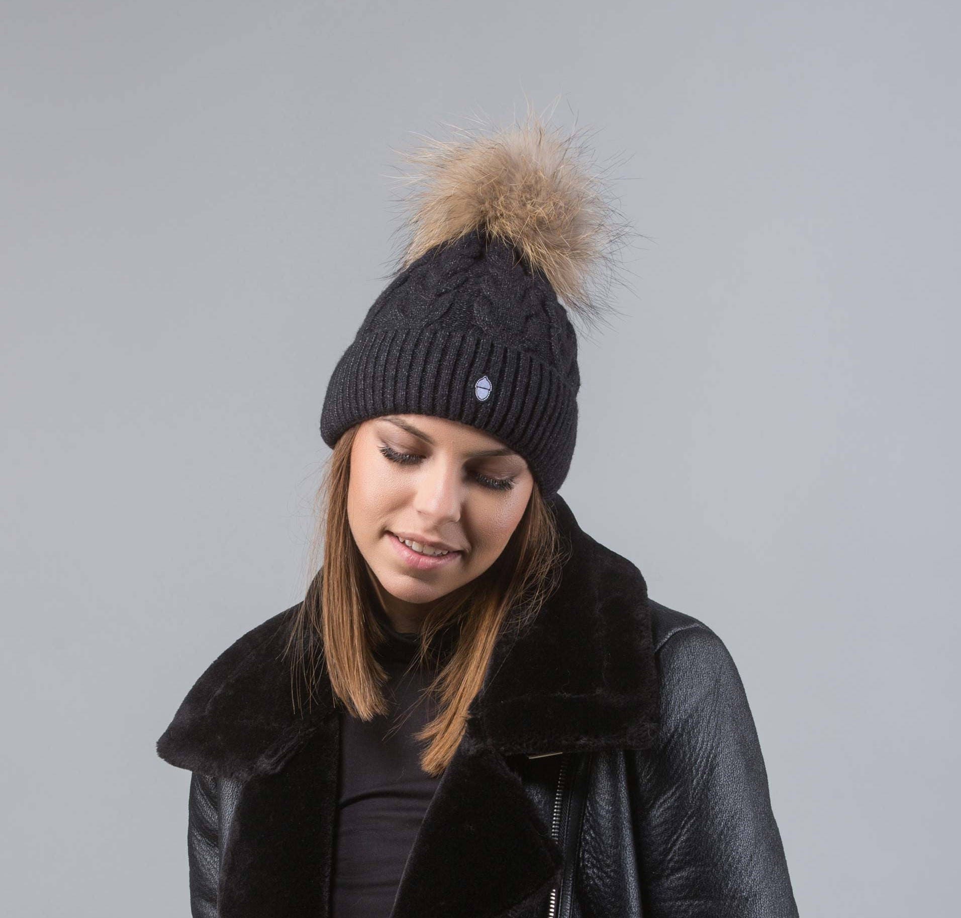 bobble hat with raccoon pom pom