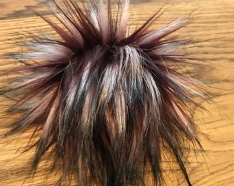 Burgandy black tip faux fur poms. Acrylic/Polyester fabric used.