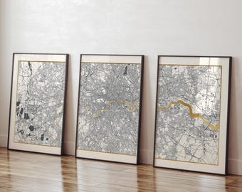 May include: Three framed black and white maps of London, England, with a gold river running through each map.