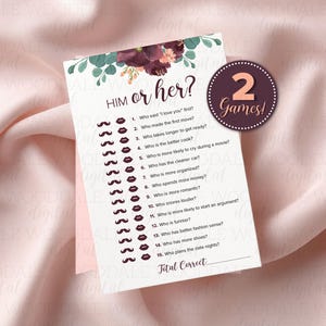 May include: A printable "Him or Her?" game card with a floral design and the text "2 Games!". The card features questions about relationships, with a space for the total correct answers. The background is a soft pink fabric.