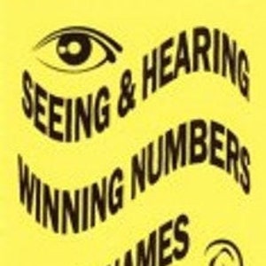 May include: A yellow book cover with the title "Seeing & Hearing Winning Numbers & Names" in black text. The cover also features a black eye and ear graphic.