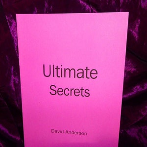 May include: A pink booklet with the title "Ultimate Secrets" and the author's name "David Anderson" printed in black.