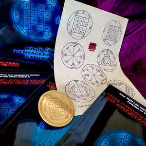 May include: A collection of books and a gold-colored metal disc with a pentagram design. The books are titled "Book 3 Pentacles of Saturn" and "The Power of Solomon the King". The books have a black background with blue and white text. The disc is on a black surface.