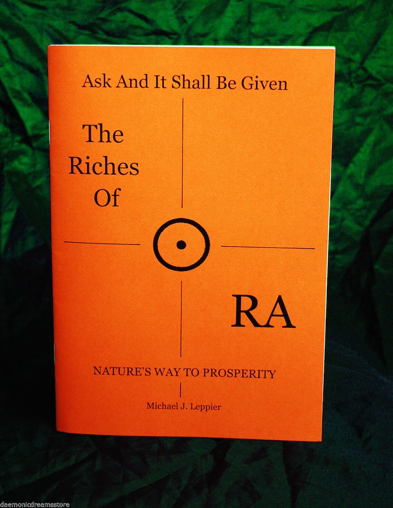 May include: An orange book titled "Ask And It Shall Be Given The Riches Of RA" with the subtitle "NATURE'S WAY TO PROSPERITY" by Michael J. Leppier.