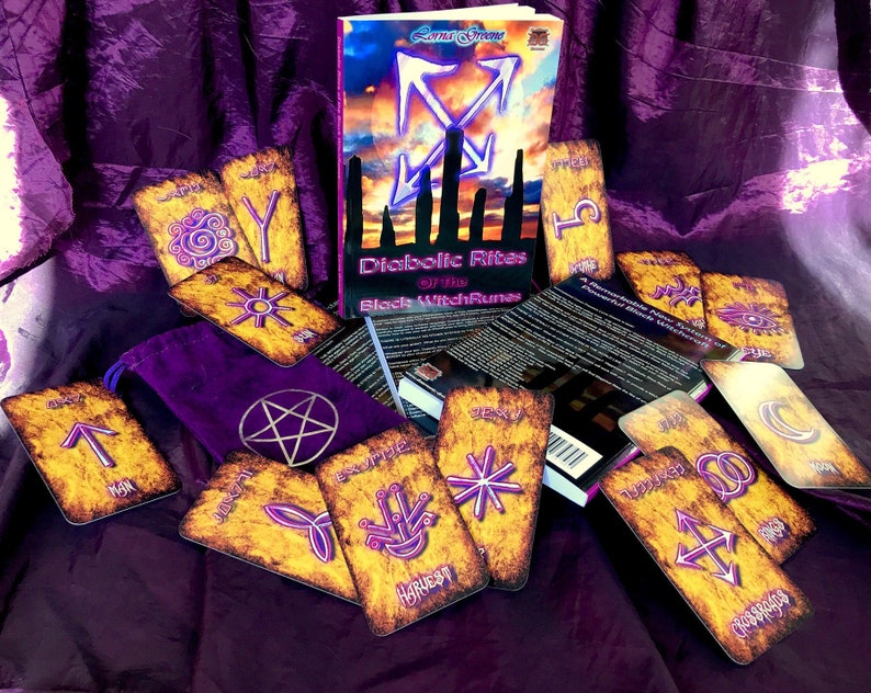 May include: A set of tarot cards with a purple background. The cards are spread out on a purple cloth. The cards have a gold and black design with a pentagram symbol. The cards are titled "Diabolic Rites of the Black Witch Runes".