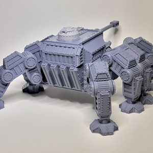 May include: A gray, 3D printed, multi-legged, tank-like model with a turret and a cannon. The model has a detailed, mechanical design.