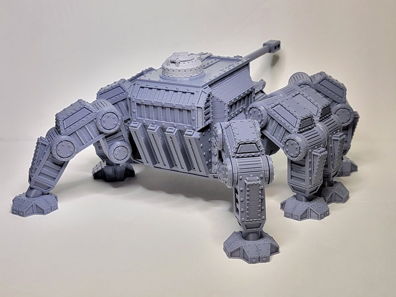 May include: A gray, 3D printed, multi-legged, tank-like model with a turret and a cannon. The model has a detailed, mechanical design.