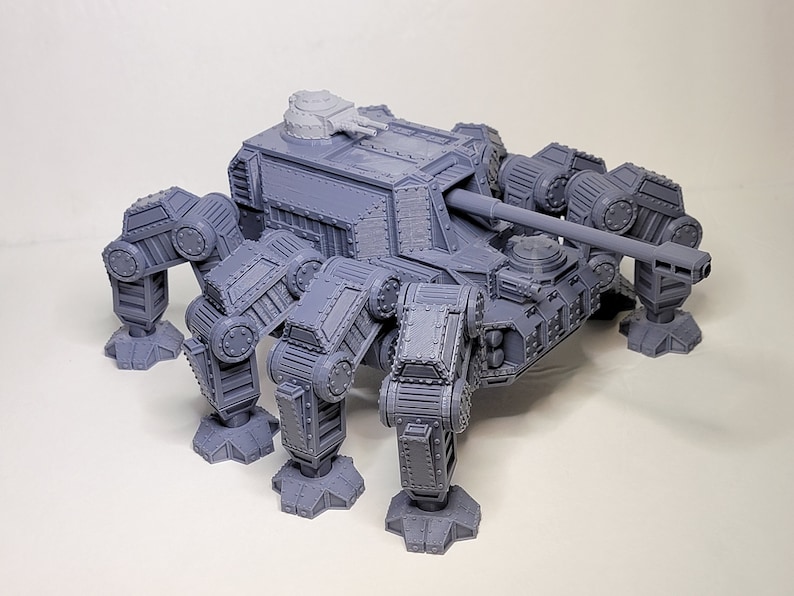 May include: A gray, 3D printed, six-legged, tank-like model with a large cannon on the top.